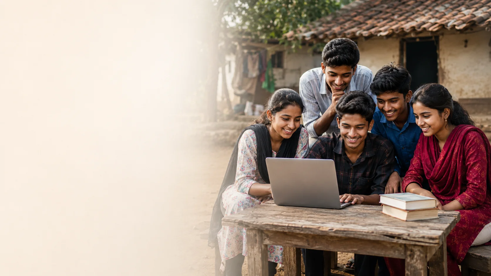 Rural Indian students learning together on a laptop